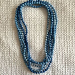 Fabric wrapped beaded necklace.